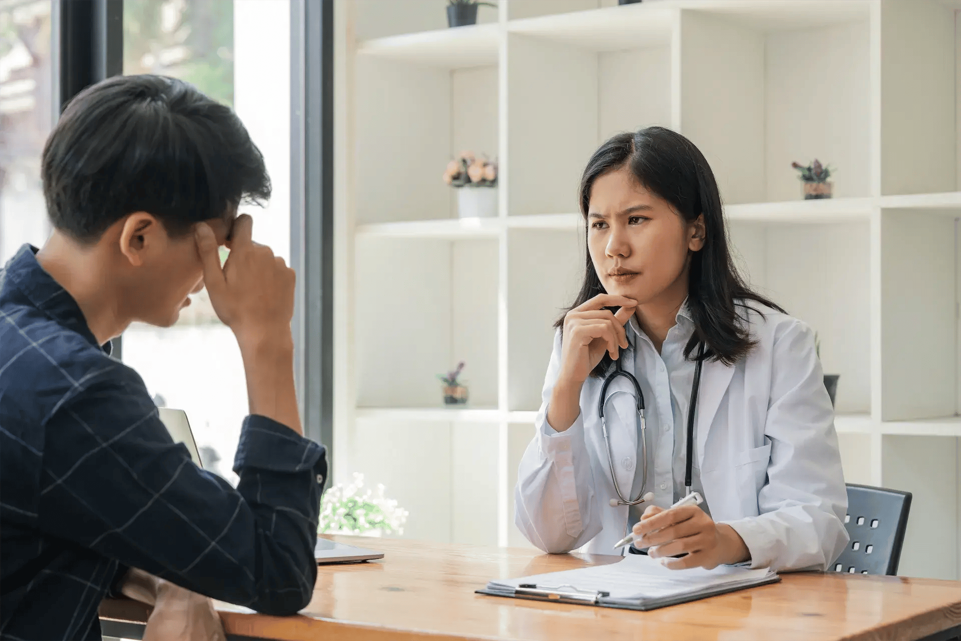 young-asian-woman-doctor-consulting-asian-worried-2025-01-10-11-29-41-utc